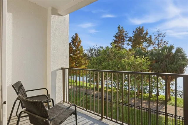 a view of a balcony with furniture
