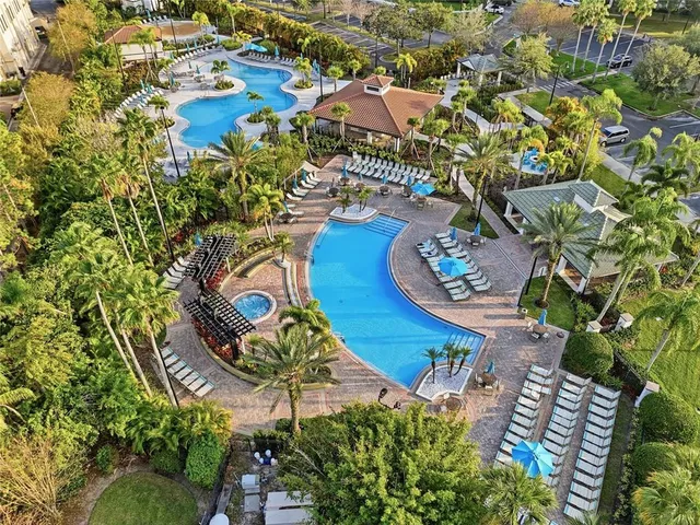 an aerial view of a house with a yard and garden