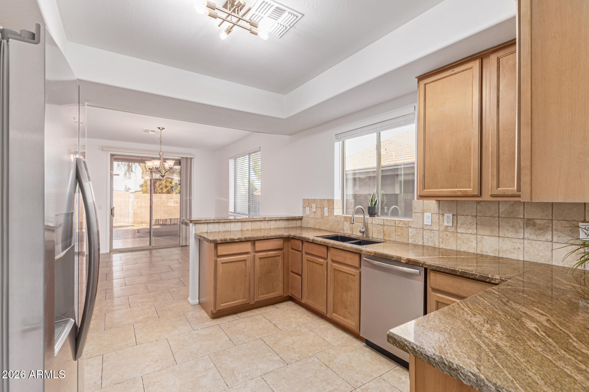 21324 Karsten Drive Maricopa, AZ 85138 - Photo 16 of 49 a kitchen with stainless steel appliances granite countertop a sink and cabinets