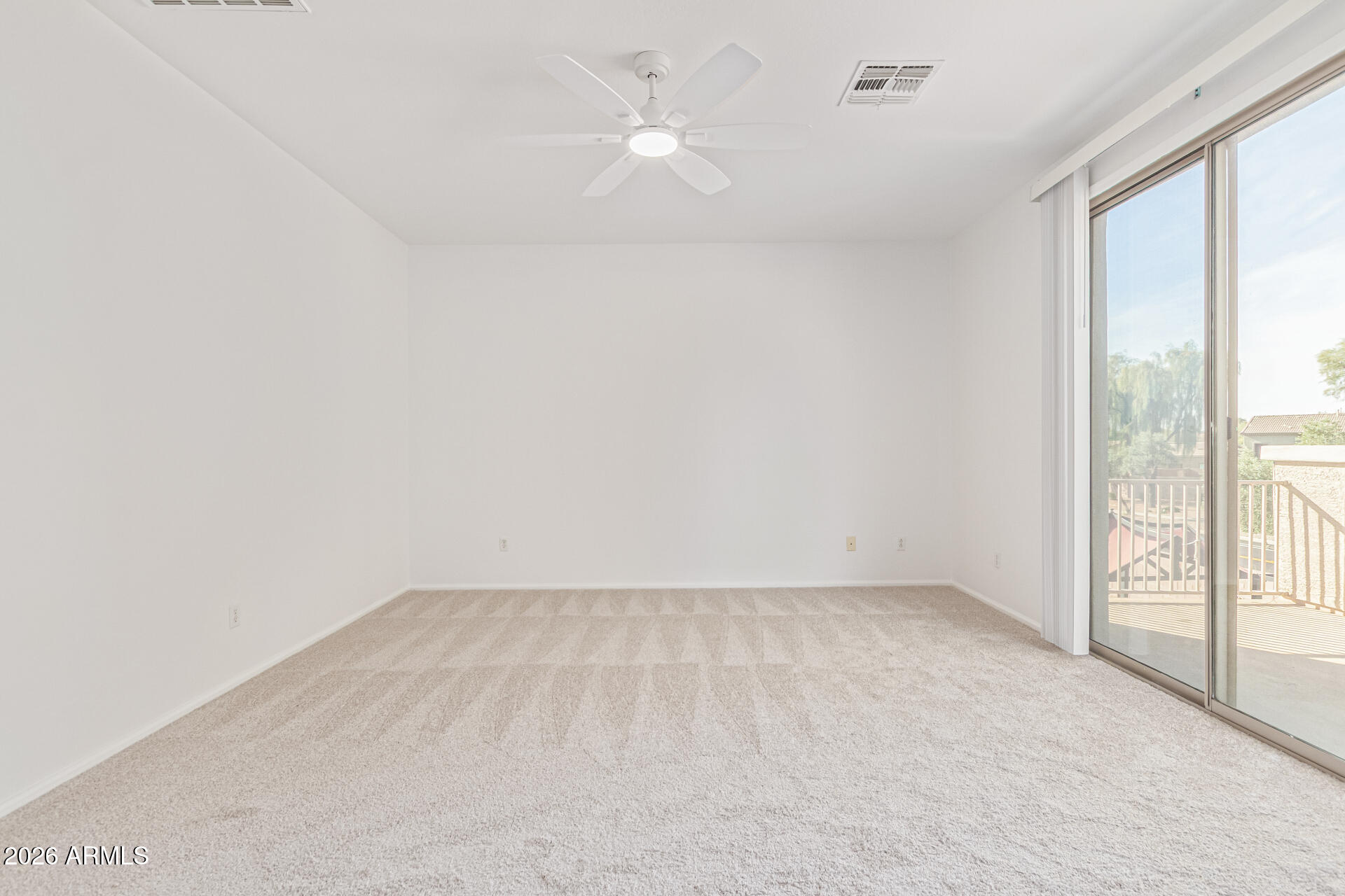 21324 Karsten Drive Maricopa, AZ 85138 - Photo 20 of 49 an empty room with a window and a ceiling fan