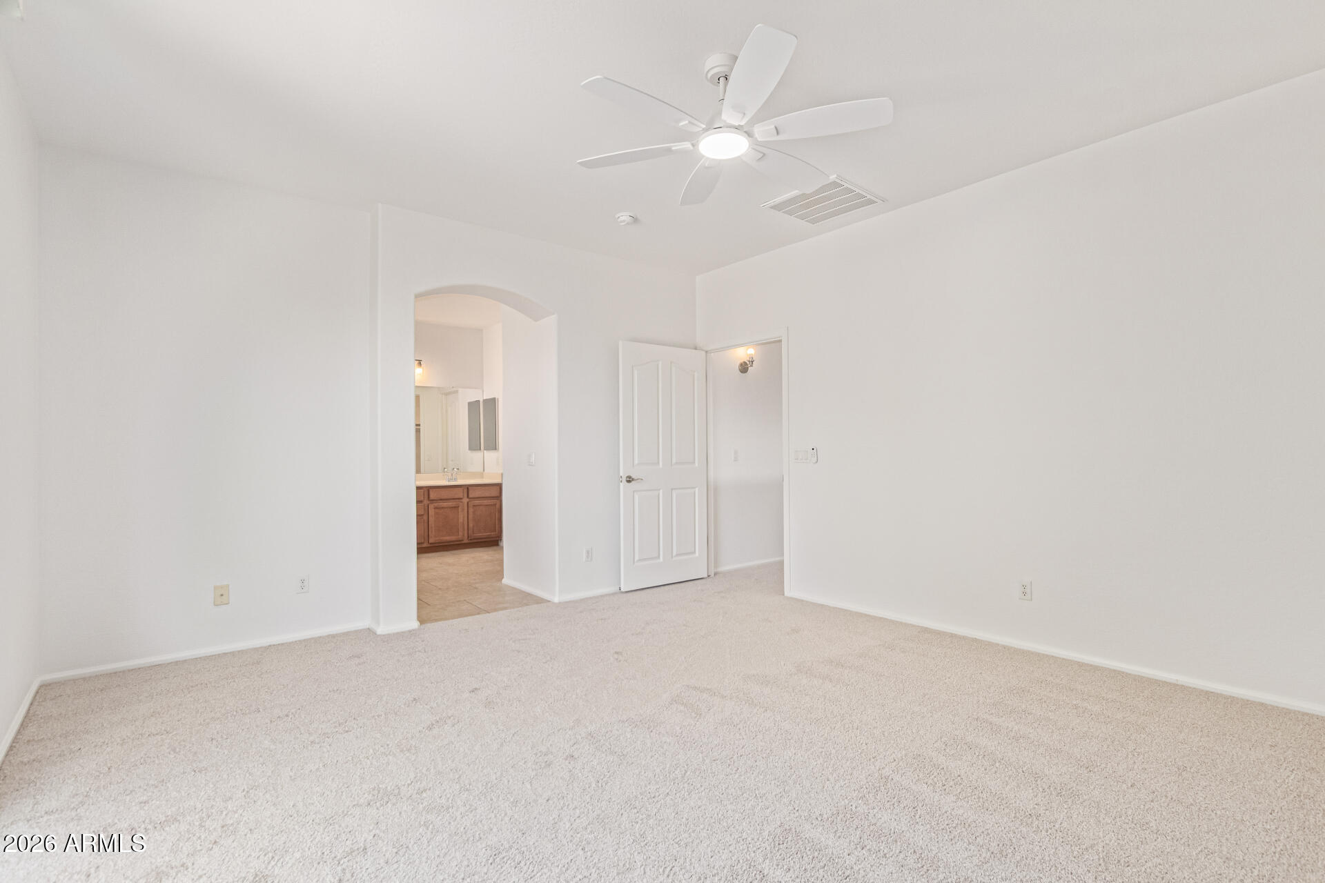 21324 Karsten Drive Maricopa, AZ 85138 - Photo 21 of 49 an empty room with a ceiling fan and hardwood floor