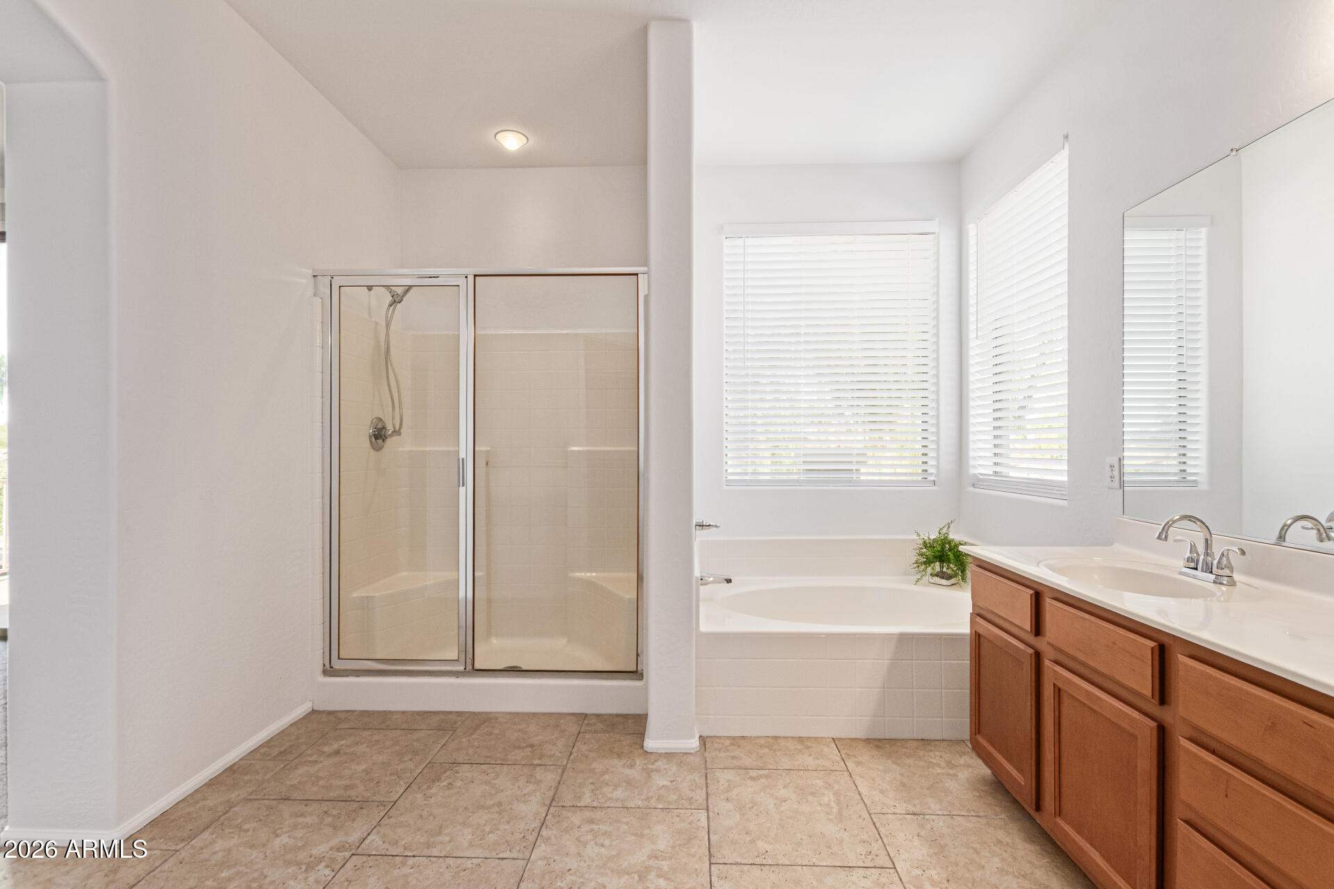 21324 Karsten Drive Maricopa, AZ 85138 - Photo 25 of 49 a bathroom with a bathtub shower and a sink
