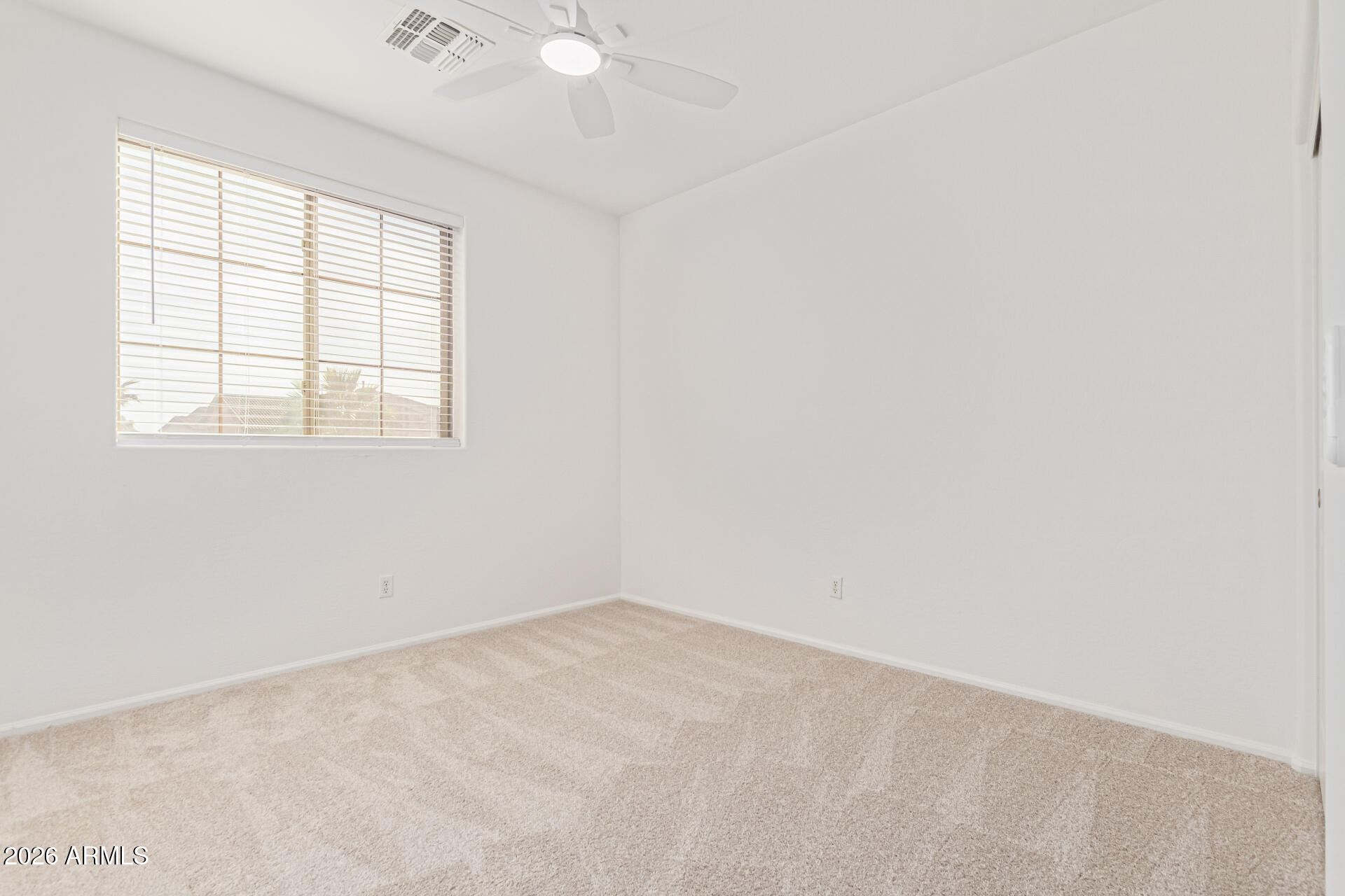 21324 Karsten Drive Maricopa, AZ 85138 - Photo 27 of 49 an empty room with a window