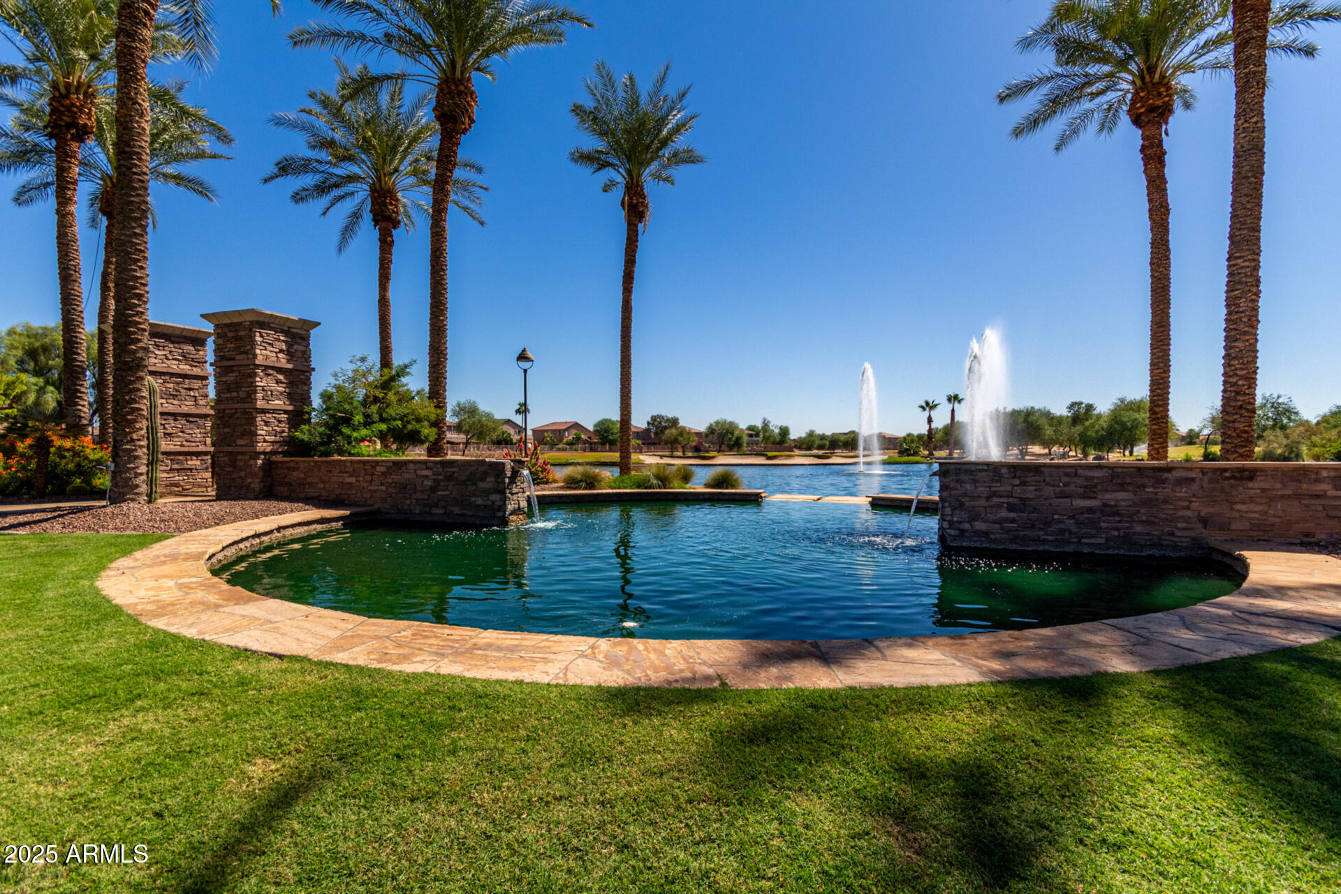 21324 Karsten Drive Maricopa, AZ 85138 - Photo 3 of 49 a view of a lake with a palm trees
