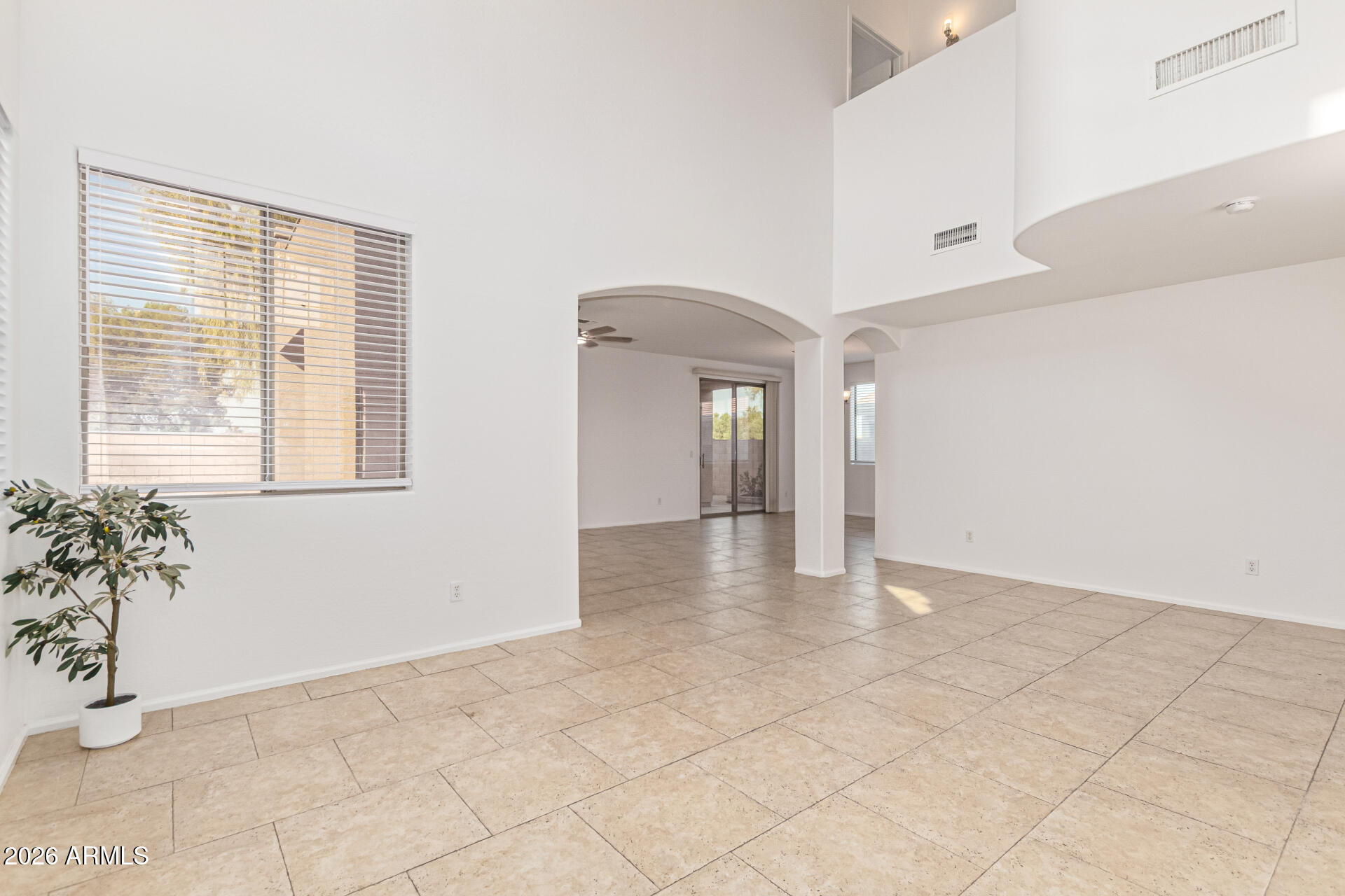 21324 Karsten Drive Maricopa, AZ 85138 - Photo 6 of 49 a view of an empty room with a window