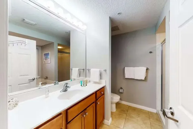 a bathroom with a glass shower door