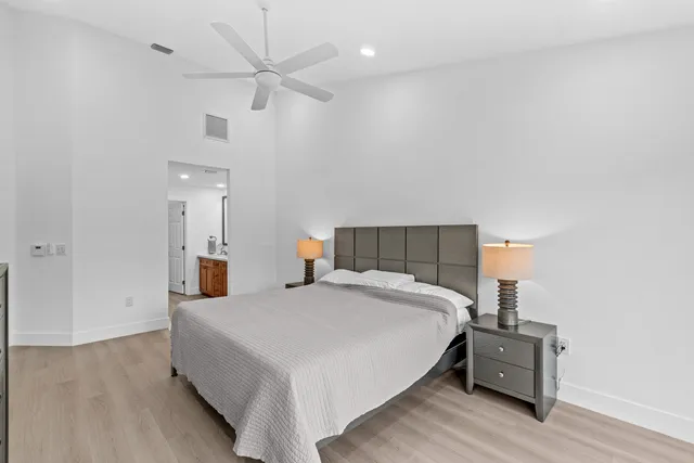 a bed room with a bed and a chandelier