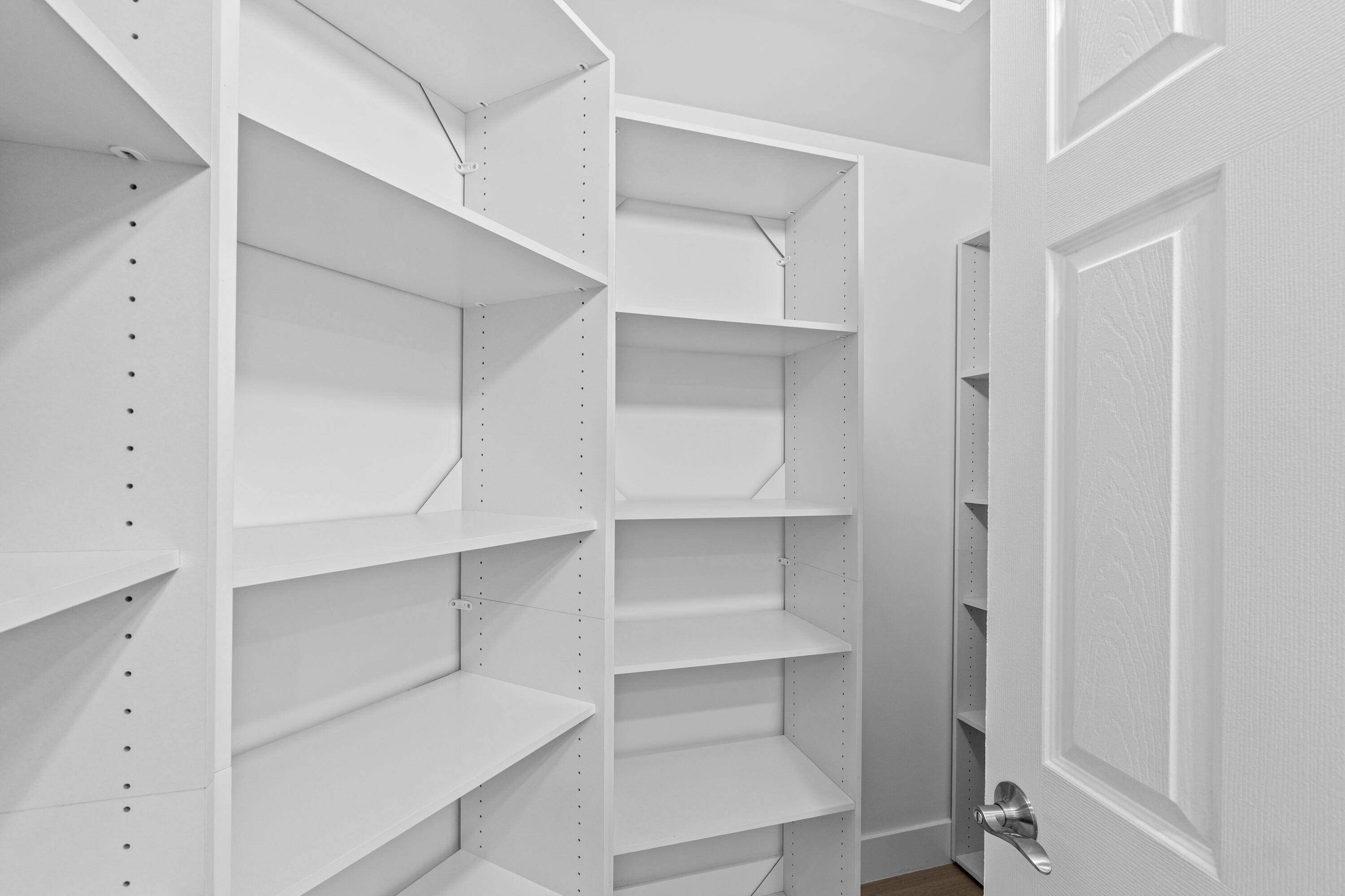 5097 Windsor Parke Drive Boca Raton, FL 33496 - Photo 21 of 30 a view of walk in closet with empty racks