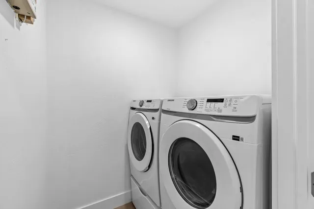 a utility room with dryer and washer