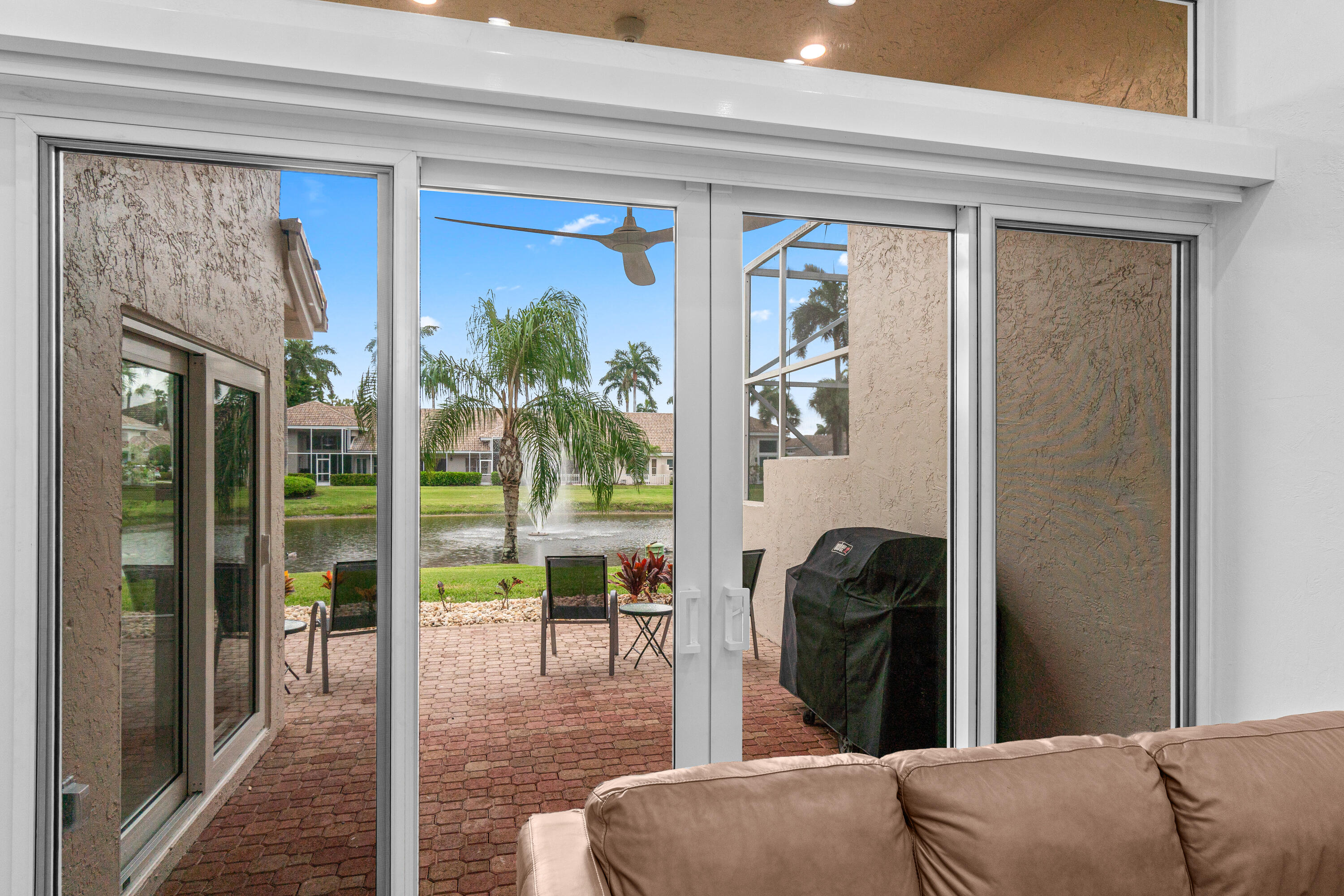 5097 Windsor Parke Drive Boca Raton, FL 33496 - Photo 9 of 30 a living room with furniture and a floor to ceiling window