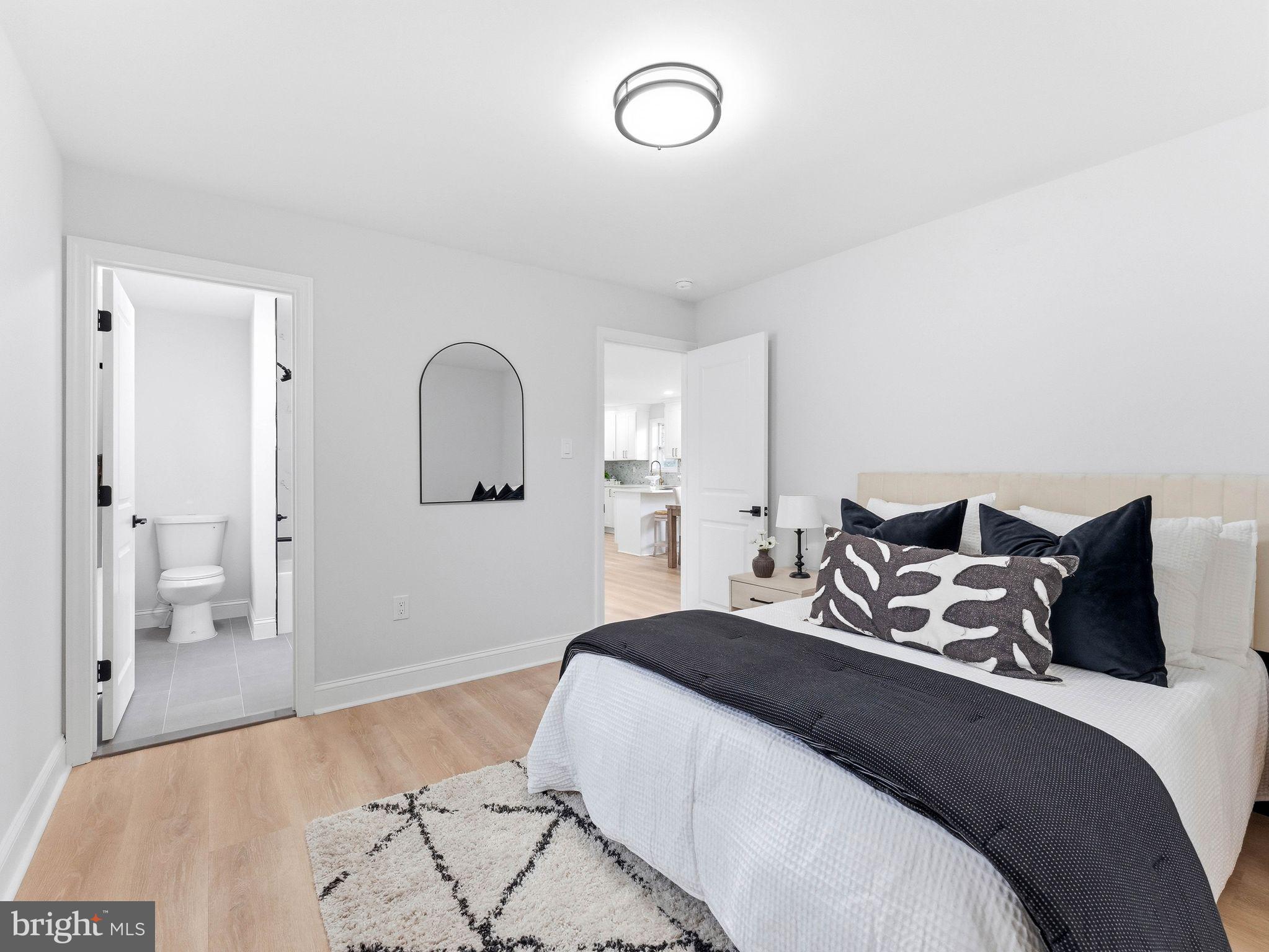 505 Greenwood Avenue Maple Shade, NJ 08052 - Photo 11 of 30 a bedroom with a bed and a mirror