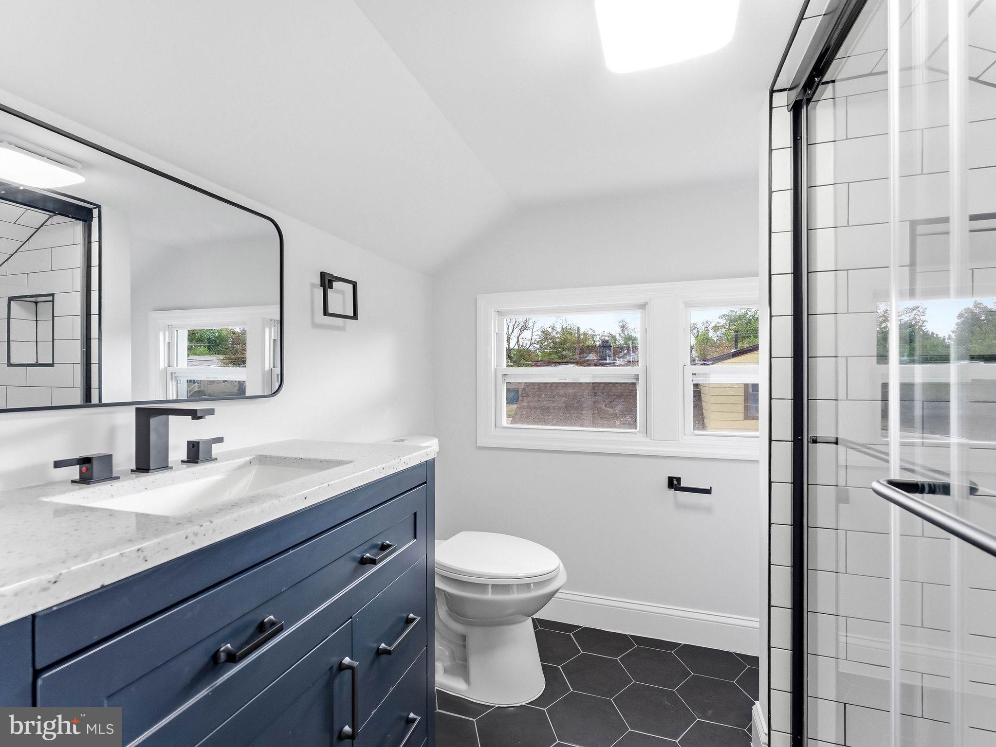 505 Greenwood Avenue Maple Shade, NJ 08052 - Photo 22 of 30 a bathroom with a granite countertop sink toilet a mirror and shower