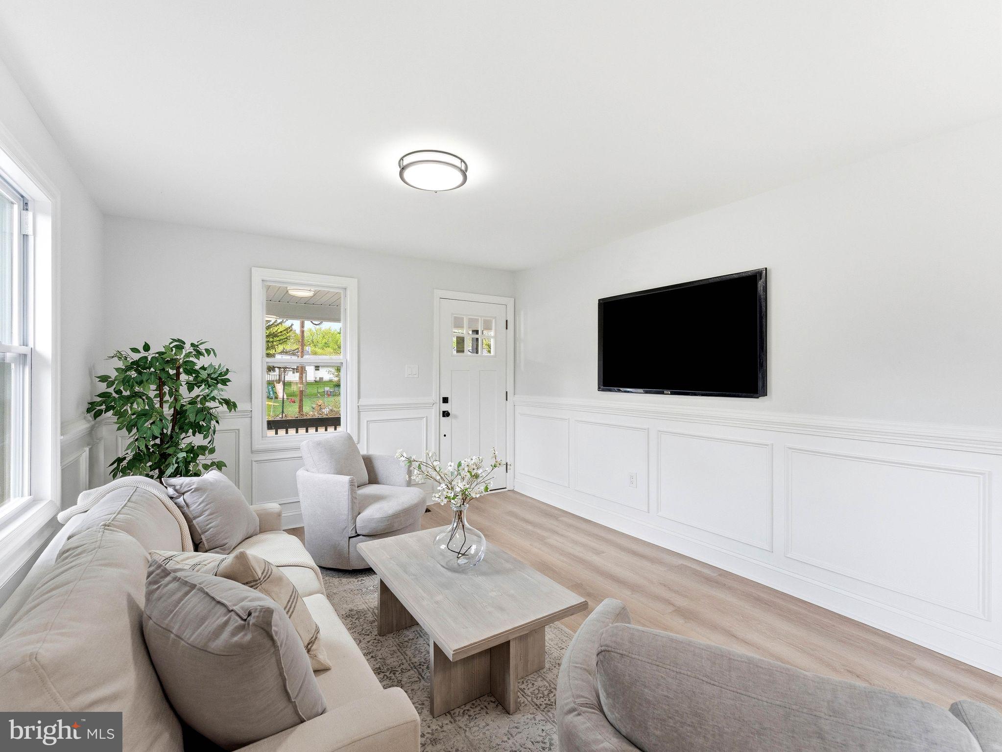 505 Greenwood Avenue Maple Shade, NJ 08052 - Photo 7 of 30 a living room with furniture and a flat screen tv
