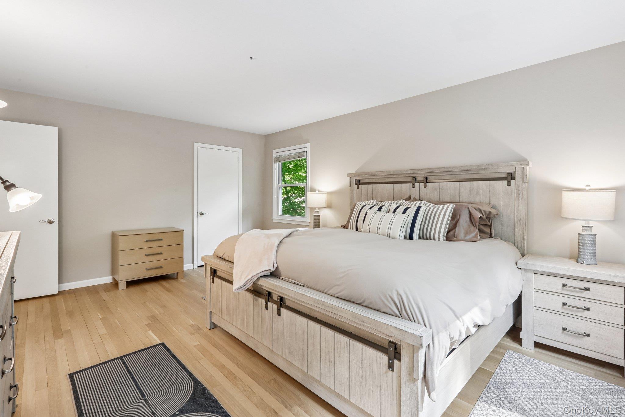 62 Mohegan Road Larchmont, NY 10538 - Photo 32 of 46 a bedroom with a bed and a couch
