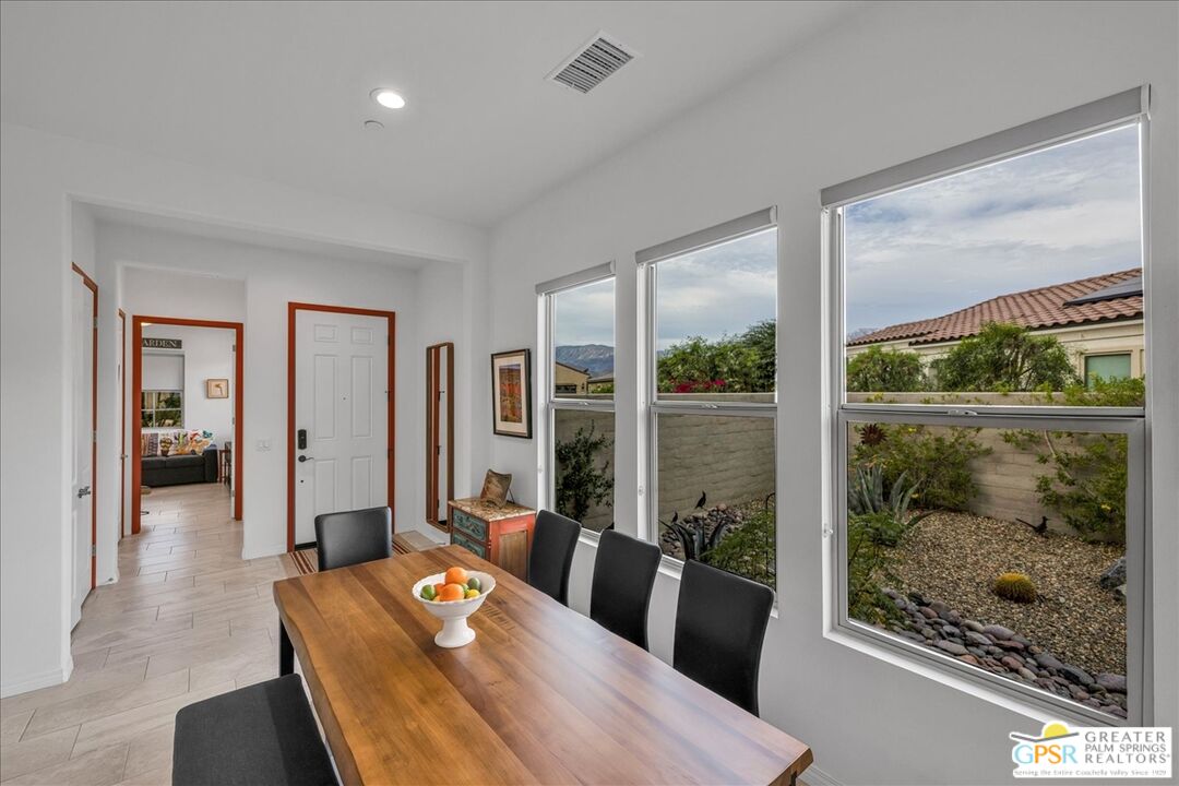 30 Cabernet Rancho Mirage, CA 92270 - Photo 12 of 31 a living room with furniture and a floor to ceiling window