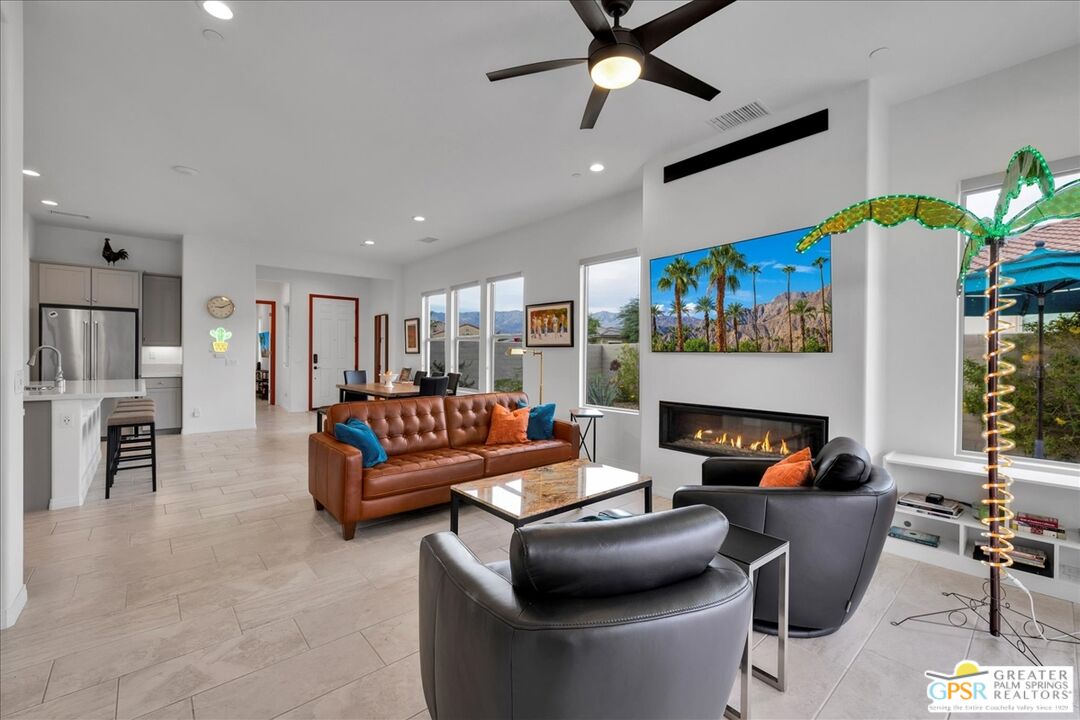 30 Cabernet Rancho Mirage, CA 92270 - Photo 13 of 31 a living room with furniture a fireplace and a flat screen tv