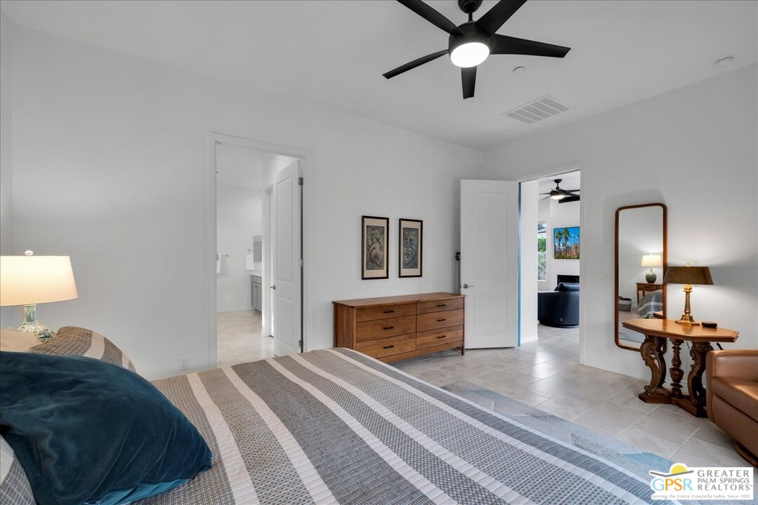 30 Cabernet Rancho Mirage, CA 92270 - Photo 20 of 31 a bedroom with a bed and wooden floor