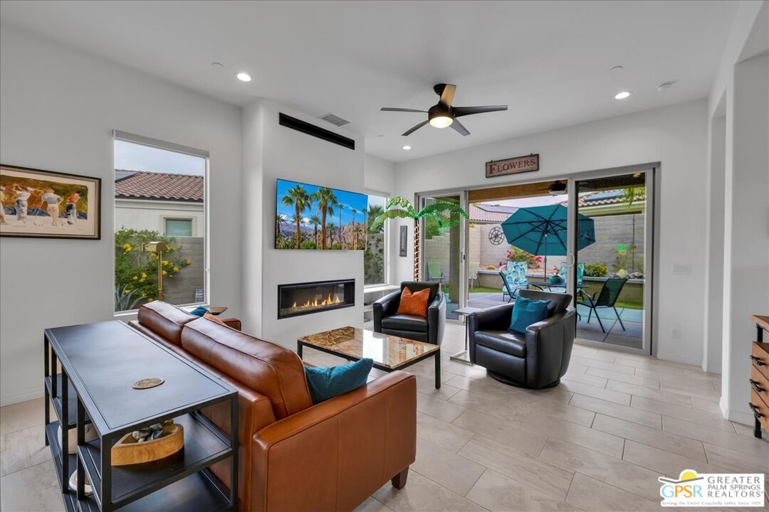 30 Cabernet Rancho Mirage, CA 92270 - Photo 2 of 31 a living room with furniture a fireplace and a flat screen tv