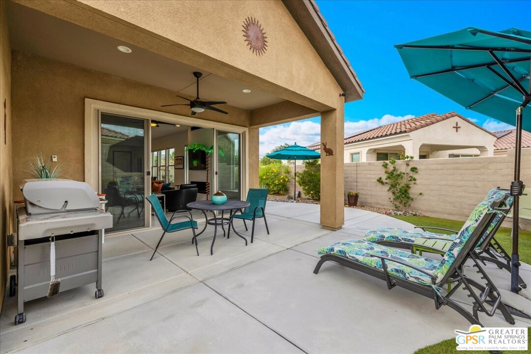 30 Cabernet Rancho Mirage, CA 92270 - Photo 27 of 31 a view of a patio with a table and chairs under an umbrella