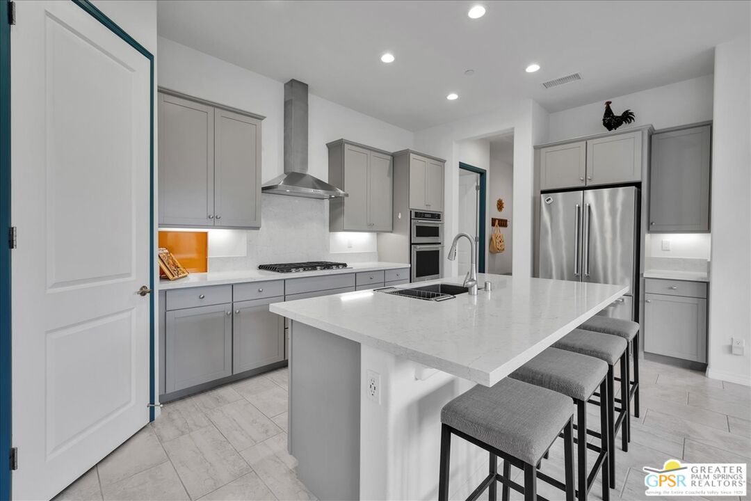 30 Cabernet Rancho Mirage, CA 92270 - Photo 3 of 31 a kitchen with a refrigerator and a stove top oven