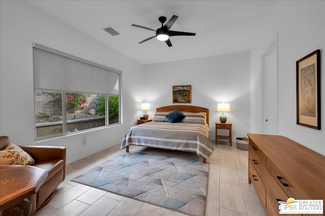 30 Cabernet Rancho Mirage, CA 92270 - Photo 4 of 31 a bedroom with a bed and glass window