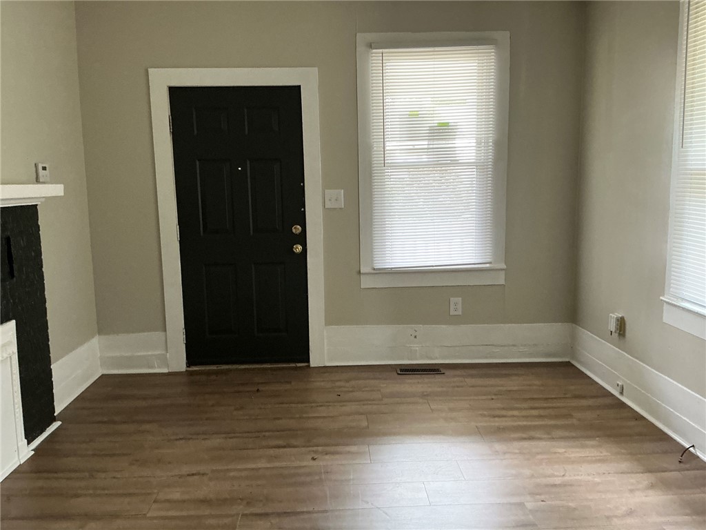 504 Caughlin Avenue Anderson, SC 29624 - Photo 4 of 15 Warm wood-toned flooring and neutral walls create an inviting atmosphere.