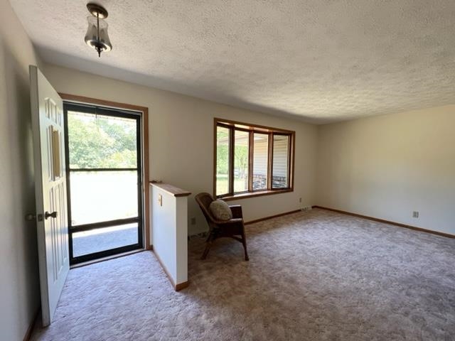 15286 Sharp Road Rockton, IL 61072 - Photo 12 of 19 a living room with a window and a dresser