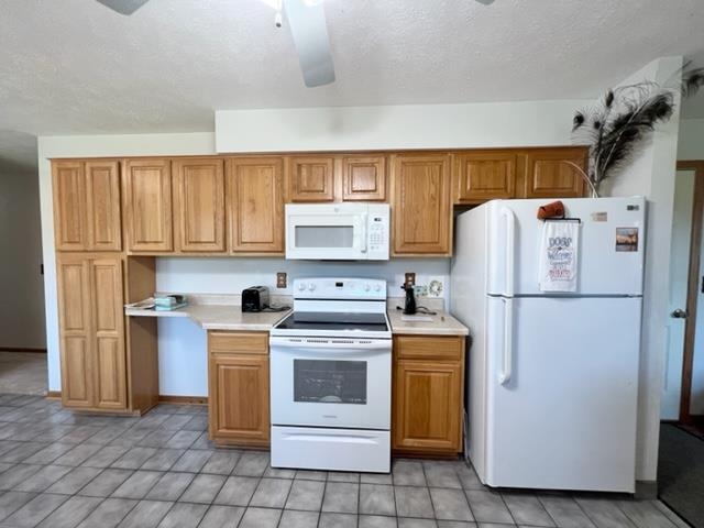 15286 Sharp Road Rockton, IL 61072 - Photo 16 of 19 a white refrigerator freezer and a stove in a kitchen