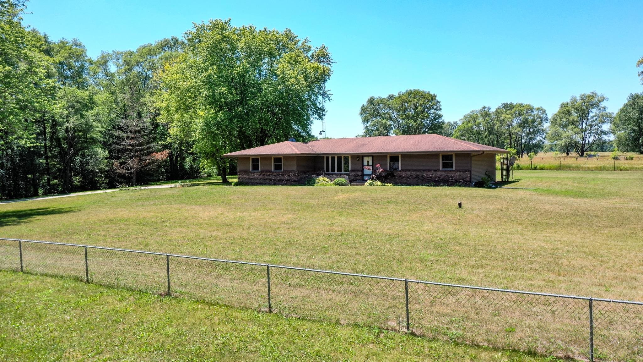 15286 Sharp Road Rockton, IL 61072 - Photo 2 of 19 a view of a swimming pool with an outdoor space and seating area