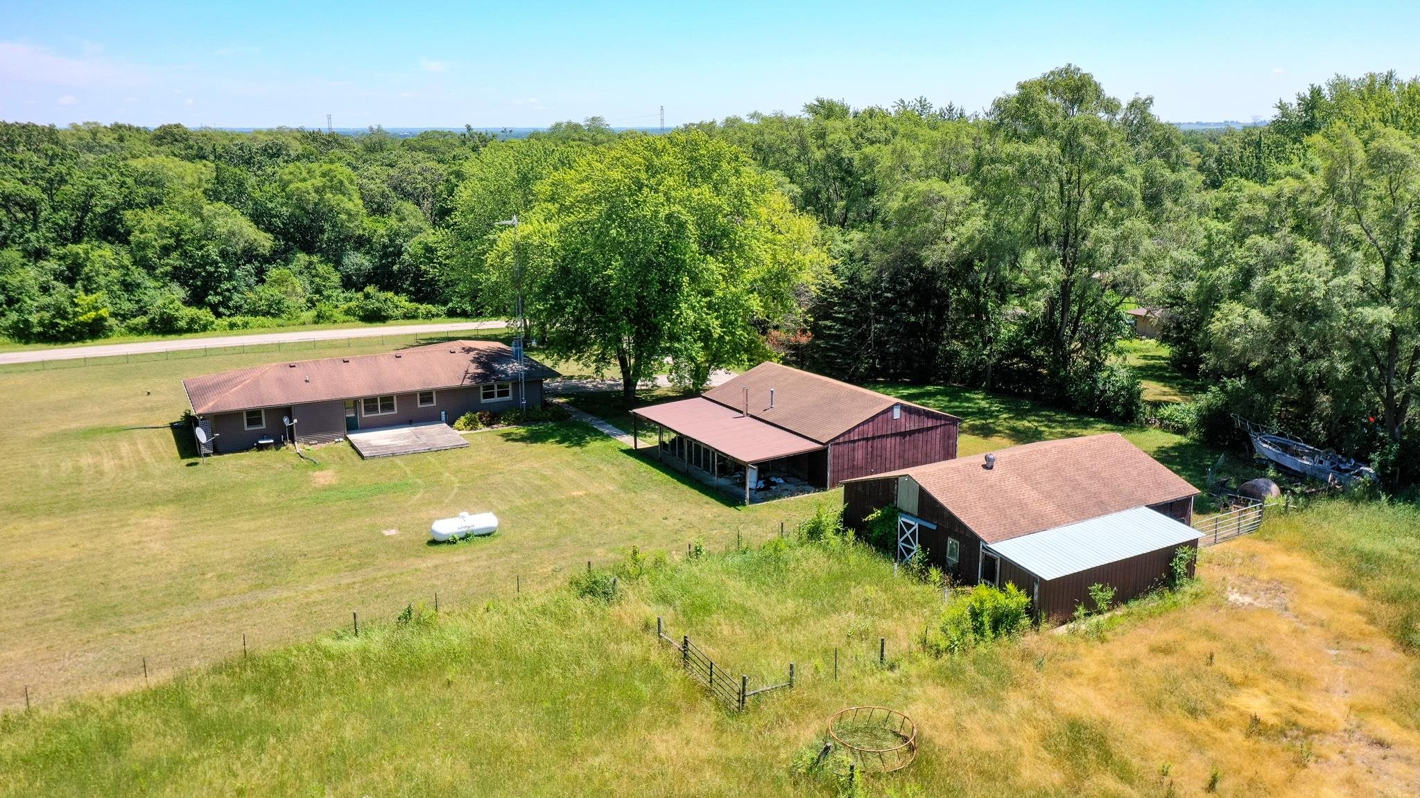 15286 Sharp Road Rockton, IL 61072 - Photo 5 of 19 an aerial view of a house with swimming pool garden and mountain view