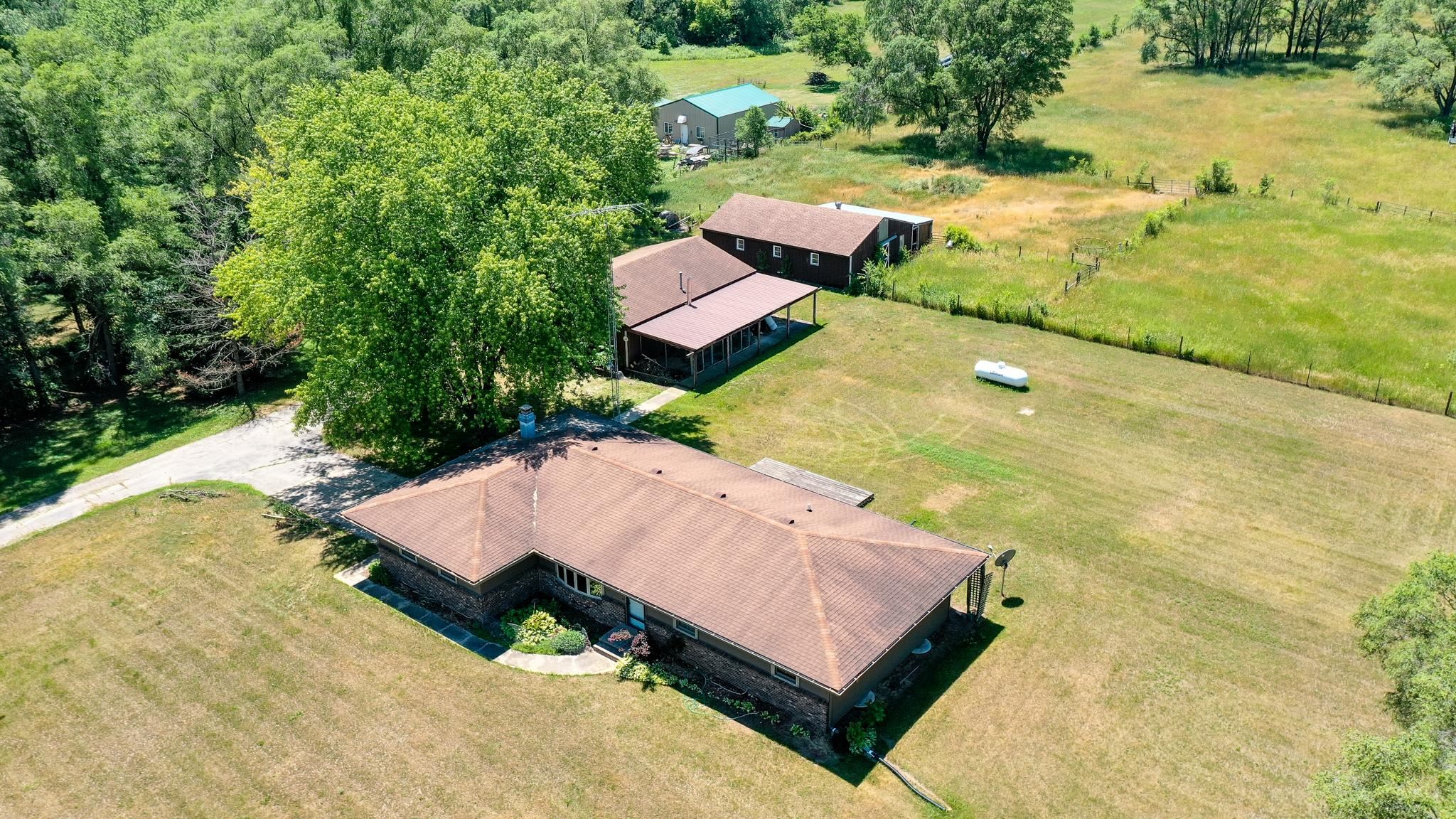 15286 Sharp Road Rockton, IL 61072 - Photo 6 of 19 an aerial view of a house with swimming pool and ocean view