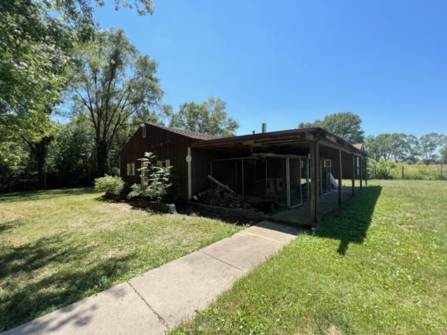 15286 Sharp Road Rockton, IL 61072 - Photo 9 of 19 a view of house with backyard space and garden