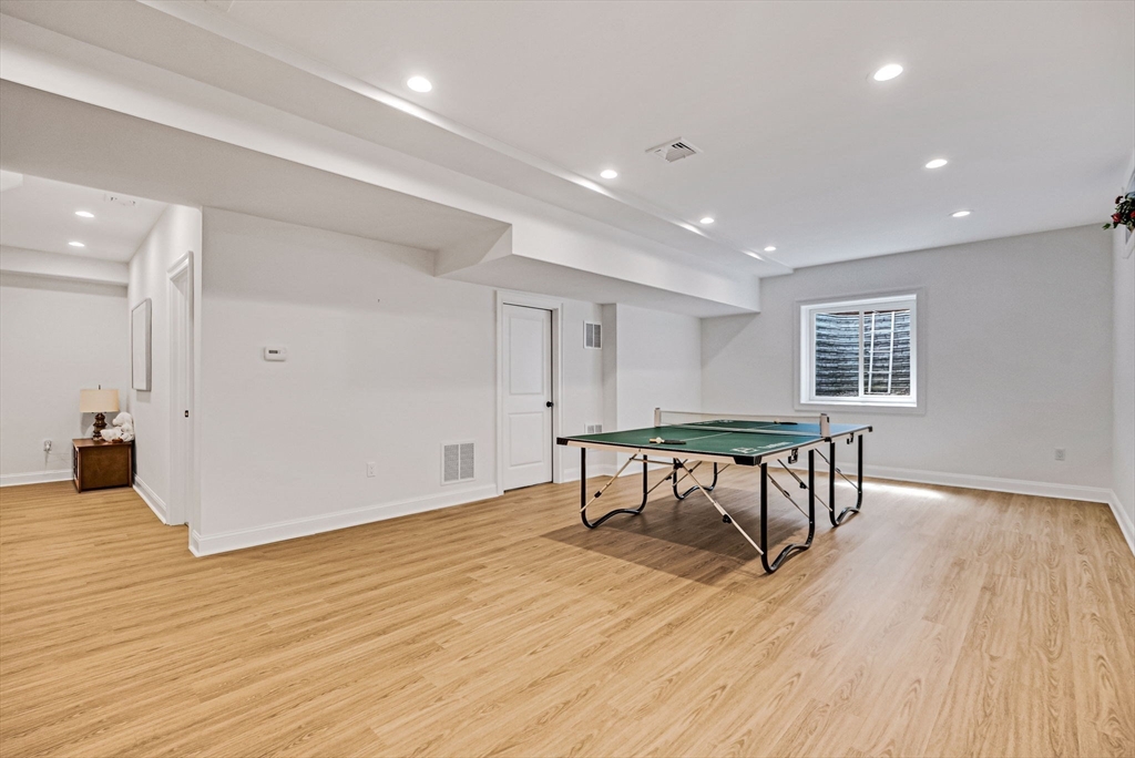 17 Sunrise Terrace Needham, MA 02492 - Photo 33 of 42 a view of a room with wooden floor and furniture