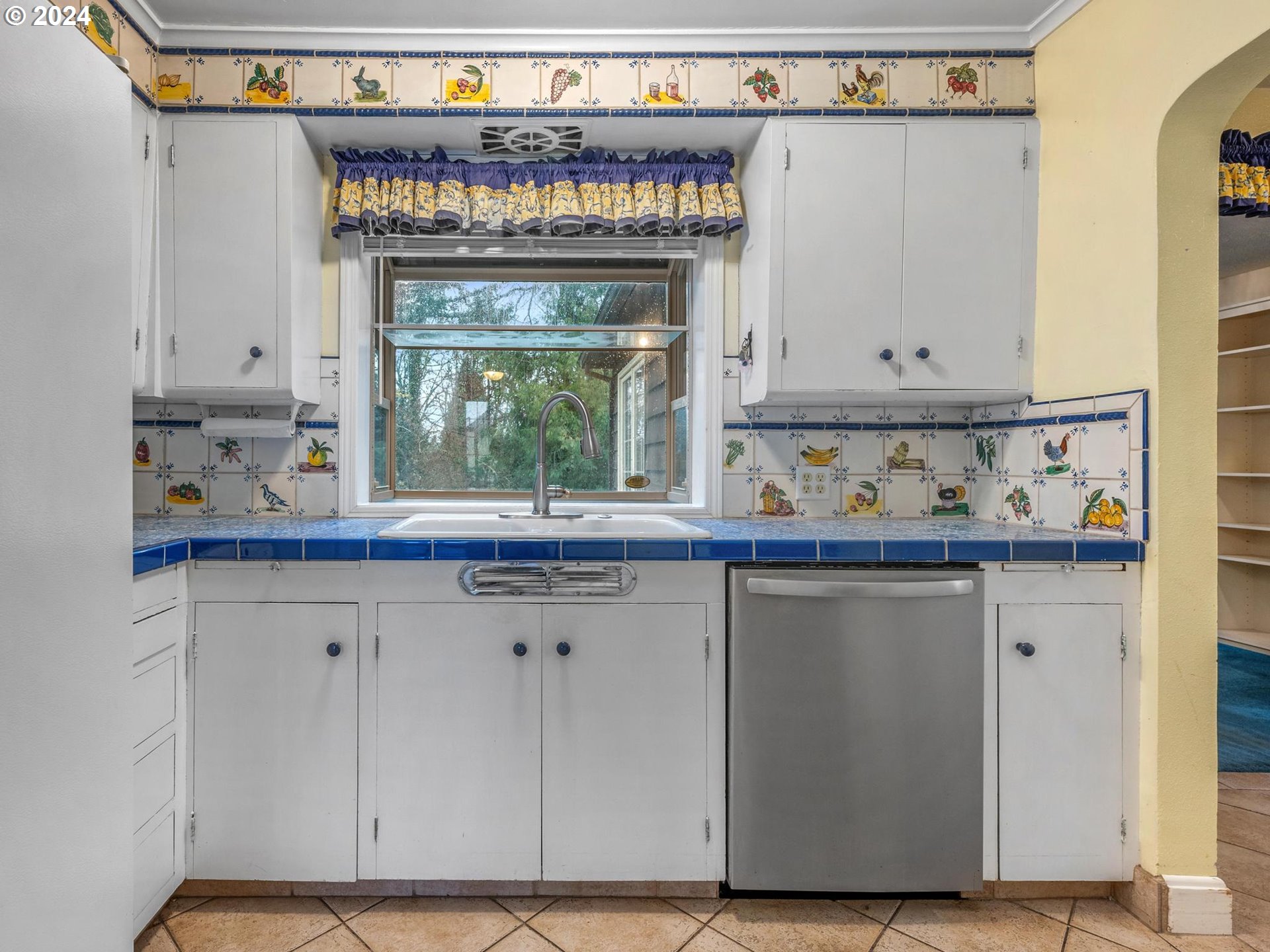 5523 Southwest Menefee Drive Portland, OR 97239 - Photo 7 of 22 a kitchen with a sink and a window