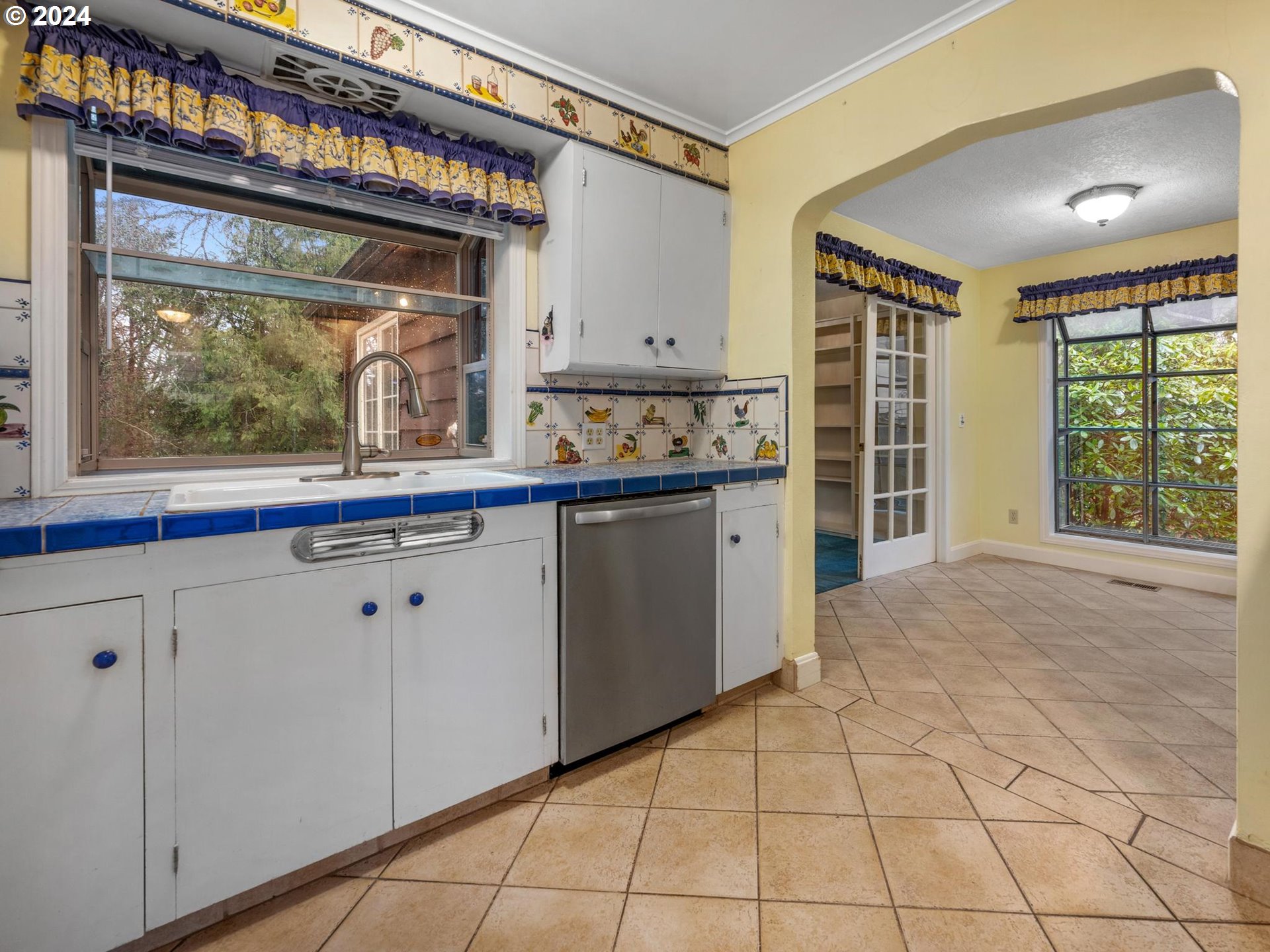 5523 Southwest Menefee Drive Portland, OR 97239 - Photo 9 of 22 a view of a kitchen with a sink