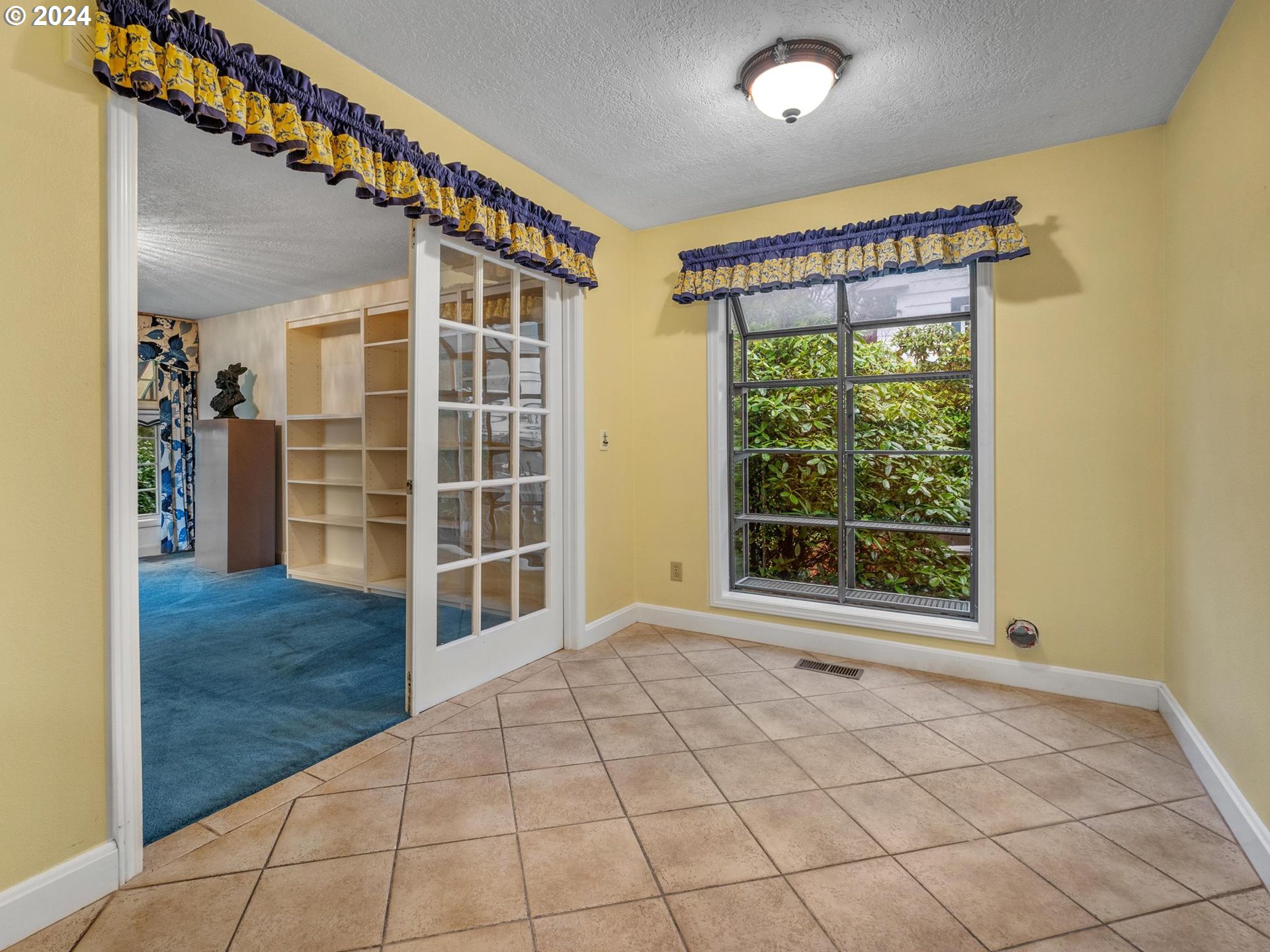 5523 Southwest Menefee Drive Portland, OR 97239 - Photo 10 of 22 a view of an empty room with a window