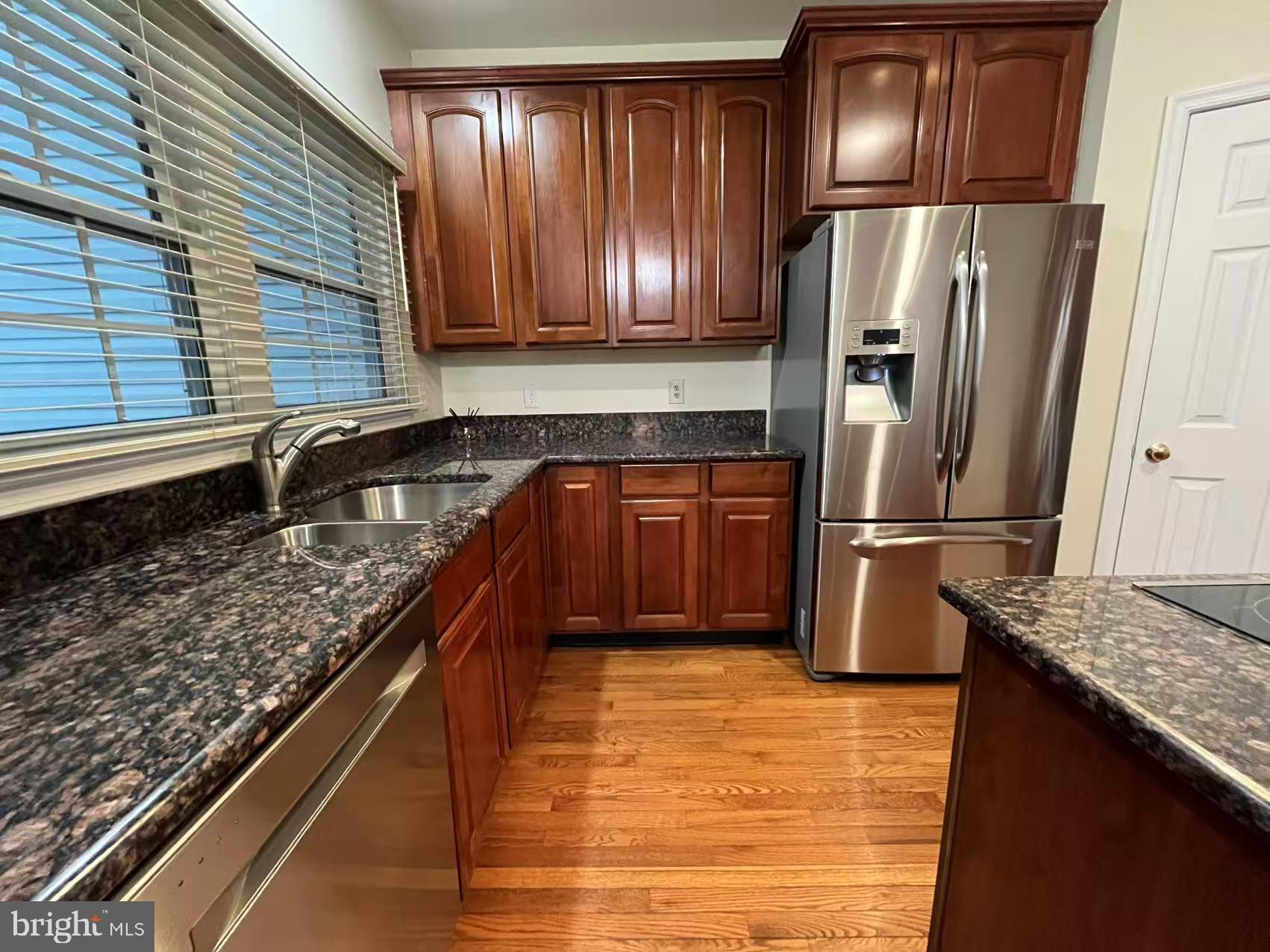 4102 Kentmere Square Fairfax, VA 22030 - Photo 26 of 55 a kitchen with granite countertop stainless steel appliances and refrigerator