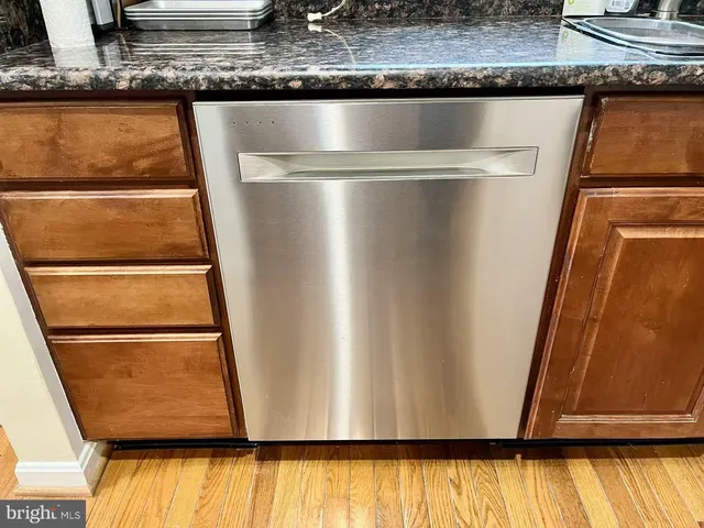 a kitchen with a stove and white cabinets