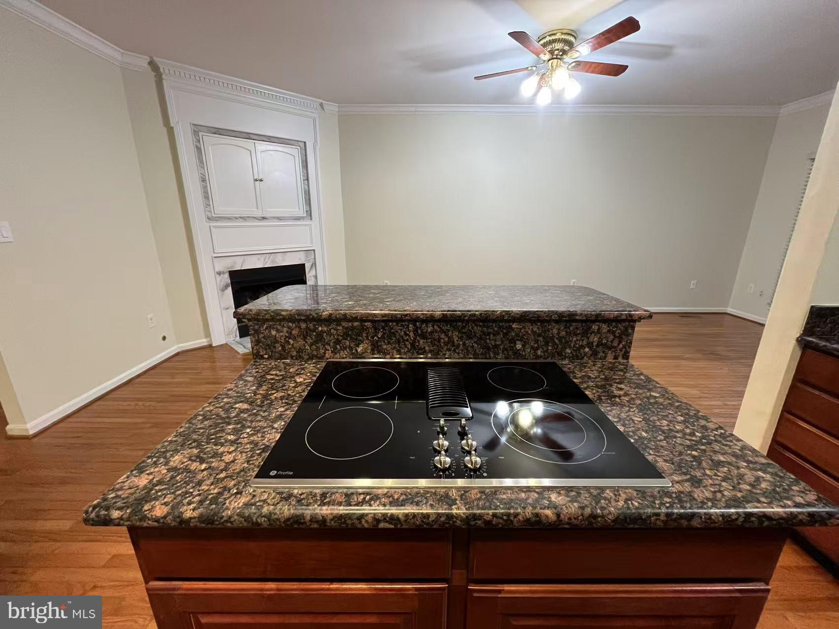 4102 Kentmere Square Fairfax, VA 22030 - Photo 28 of 55 a kitchen with a stove and white cabinets