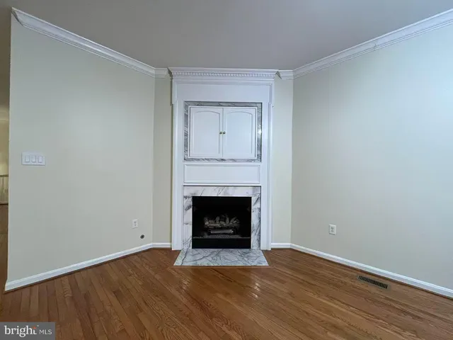 a kitchen with stainless steel appliances granite countertop a refrigerator a sink and a stove