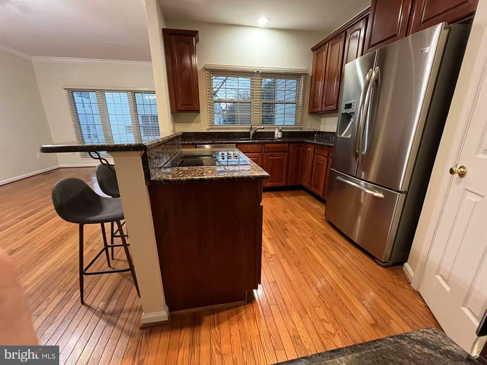 4102 Kentmere Square Fairfax, VA 22030 - Photo 30 of 55 a kitchen with stainless steel appliances granite countertop a refrigerator a sink and a stove