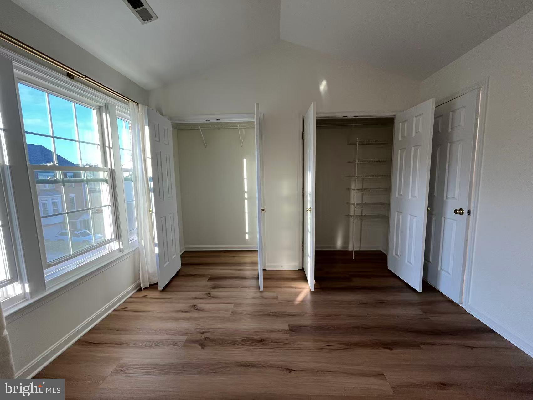 4102 Kentmere Square Fairfax, VA 22030 - Photo 37 of 55 wooden floor in an empty room with a window