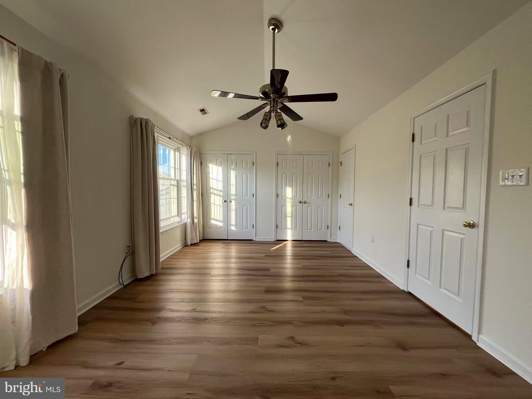 4102 Kentmere Square Fairfax, VA 22030 - Photo 38 of 55 a view of an empty room with window and wooden floor