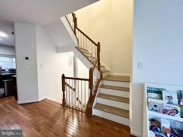 a view of entryway with wooden floor and stairs