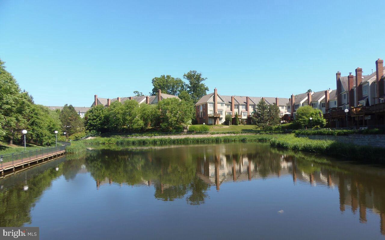 4102 Kentmere Square Fairfax, VA 22030 - Photo 52 of 55 a view of a lake with a house in the background