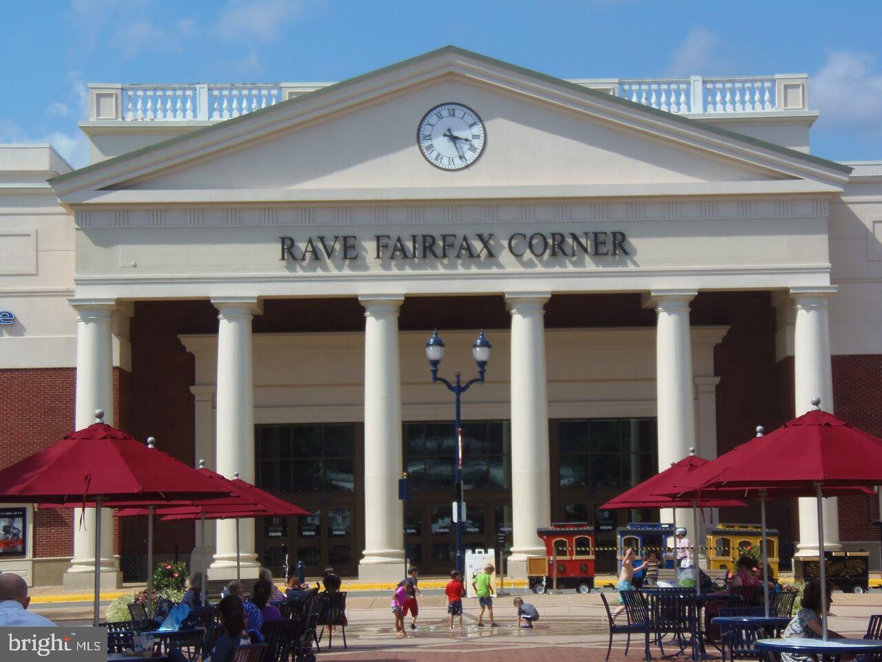 4102 Kentmere Square Fairfax, VA 22030 - Photo 55 of 55 a view of a cafe with a table and chairs under an umbrella