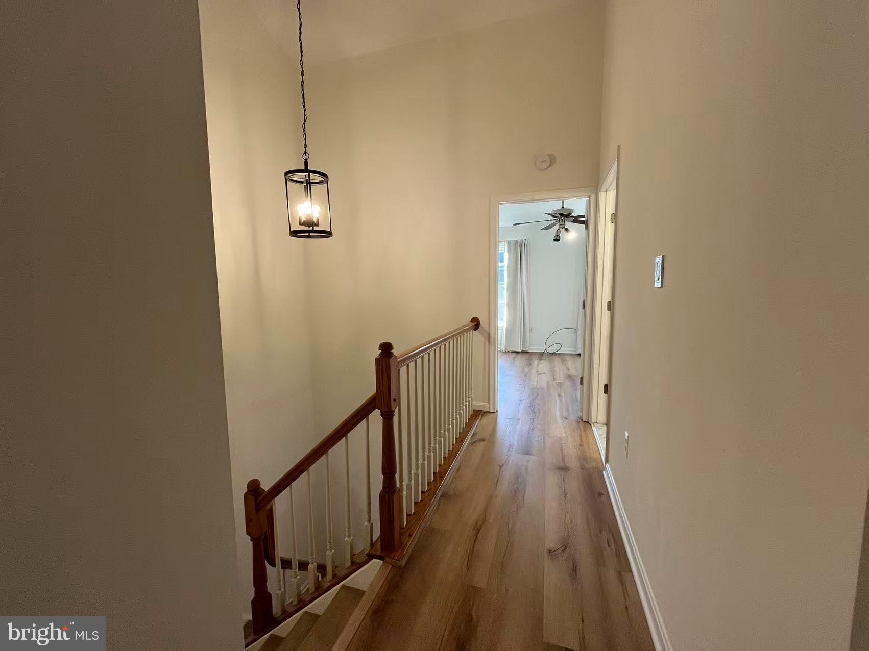 4102 Kentmere Square Fairfax, VA 22030 - Photo 9 of 55 a view of a hallway with wooden floor and staircase