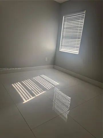 a bathroom with a granite countertop sink a toilet and bathtub