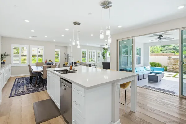 a kitchen that has a lot of cabinets in it and appliances