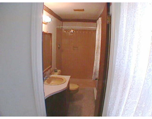 31 Westhampton Road Northampton, MA 01062 - Photo 5 of 6 a bathroom with a sink a toilet a mirror and shower